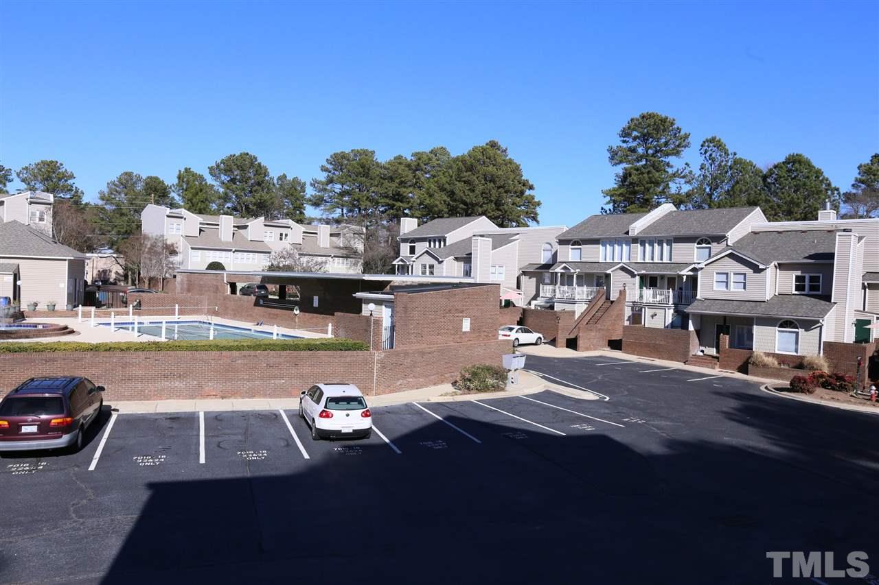 7040 Sandy Forks Road, Unit 201 Raleigh, NC 27615 - Photo 23 of 29 a view of a patio with swimming pool