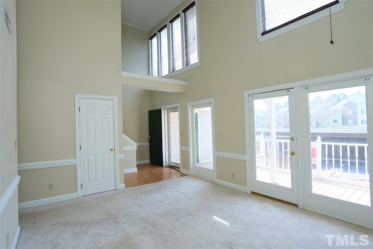 7040 Sandy Forks Road, Unit 201 Raleigh, NC 27615 - Photo 4 of 29 a view of an empty room with a window