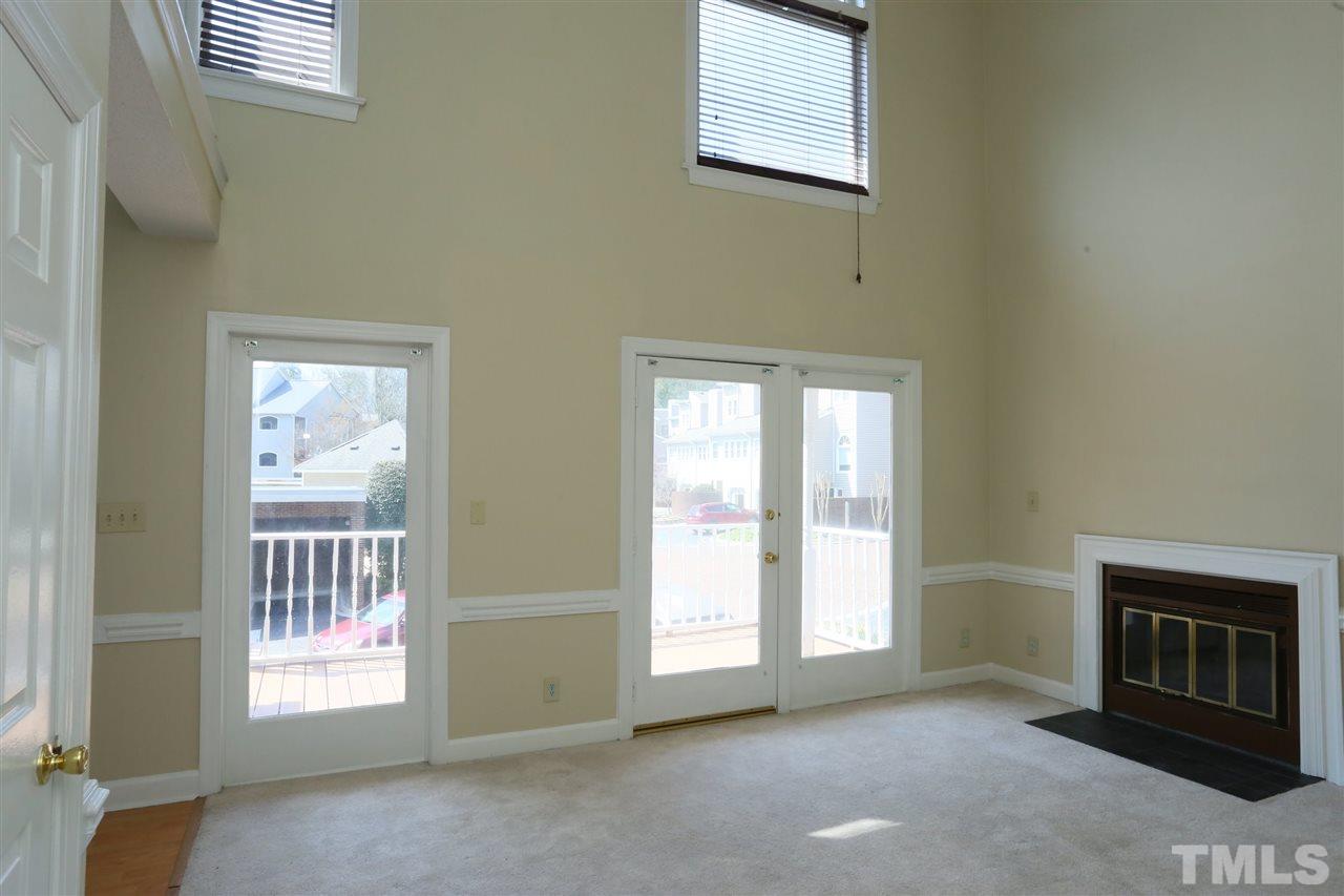 7040 Sandy Forks Road, Unit 201 Raleigh, NC 27615 - Photo 5 of 29 a view of an empty room with a window