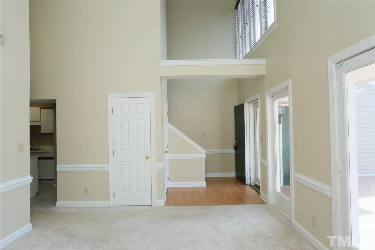 7040 Sandy Forks Road, Unit 201 Raleigh, NC 27615 - Photo 6 of 29 an entryway view with staircase