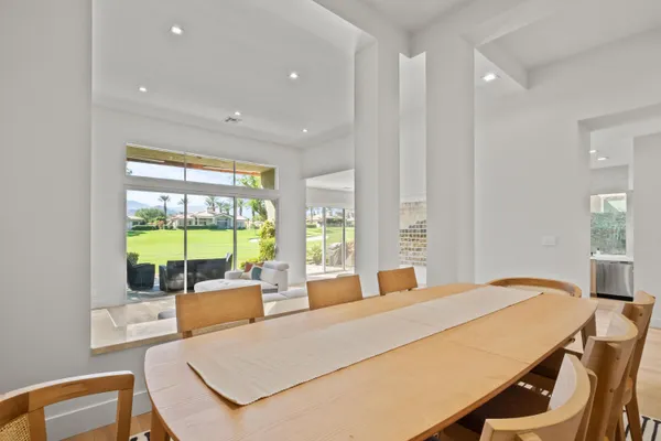 a bed room with a bed and glass windows