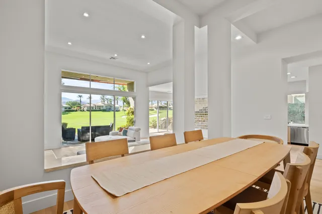 a bed room with a bed and glass windows