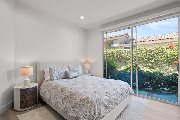a view of livingroom with bedroom and workspace