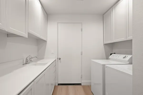 a view of a house with a yard and a garage