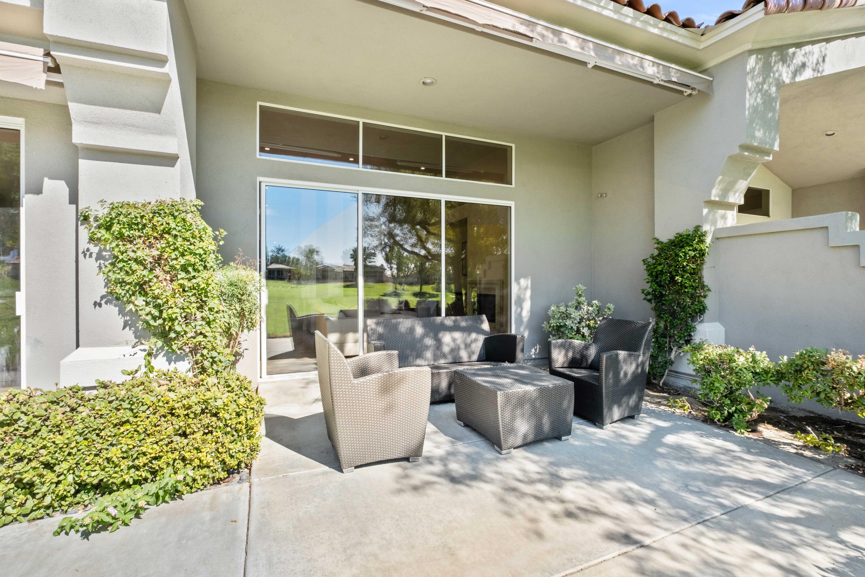 781 Box Canyon Trail Palm Desert, CA 92211 - Photo 29 of 31 a view of a patio with couches and potted plants