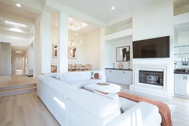 a living room with fireplace furniture and a flat screen tv