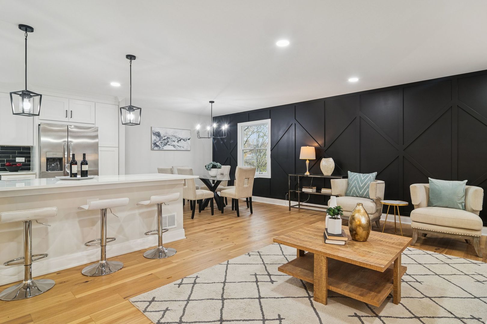 1420 Hassell Road Hoffman Estates, IL 60169 - Photo 4 of 26 a living room with couches and kitchen view with wooden floor