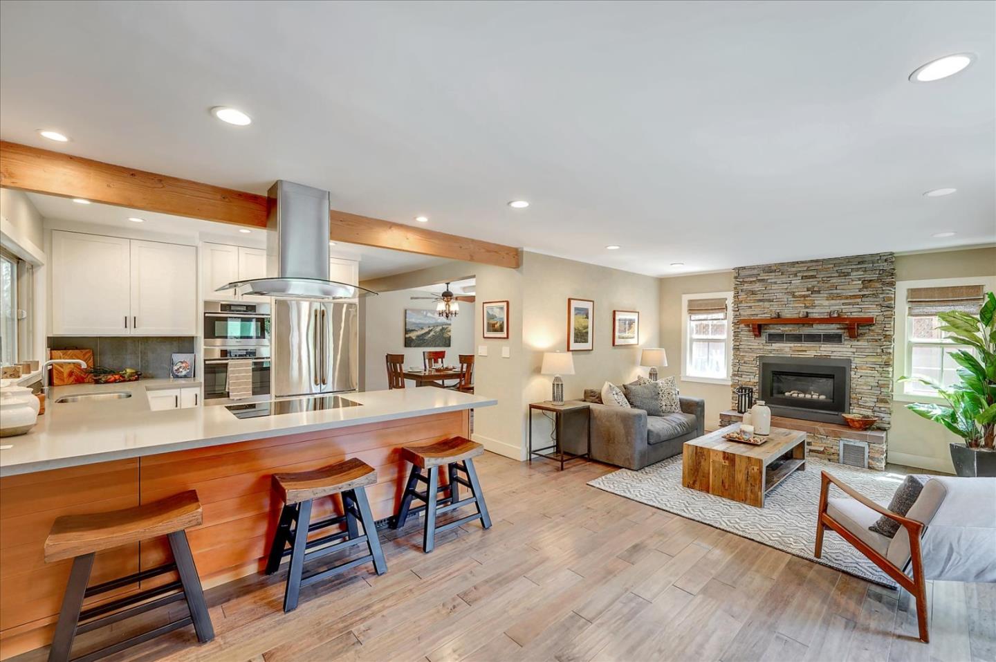 77 Forest Road Mount Hermon, CA 95041 - Photo 11 of 46 a large living room with stainless steel appliances furniture a fireplace and a kitchen view