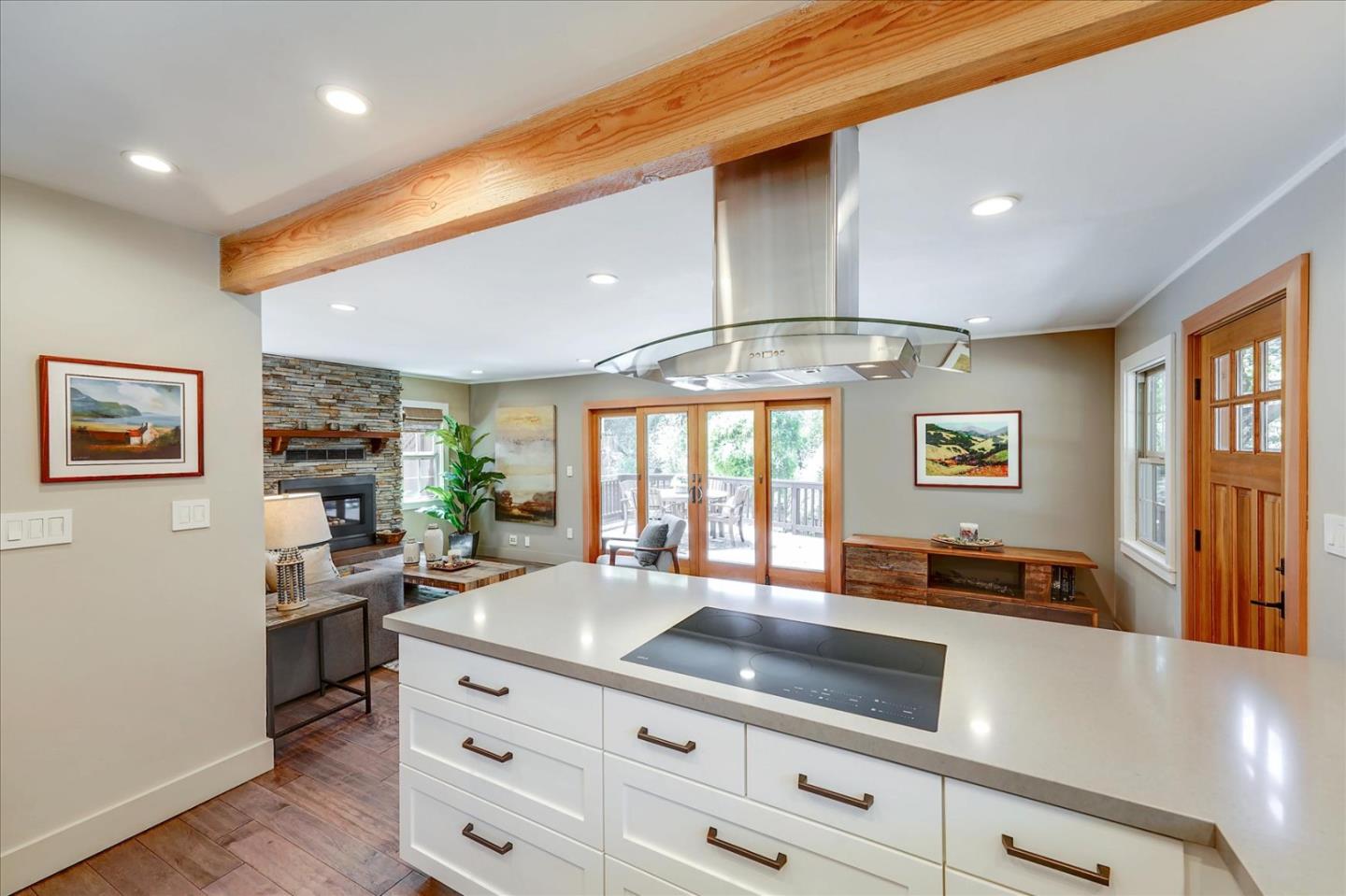 77 Forest Road Mount Hermon, CA 95041 - Photo 13 of 46 a kitchen with granite countertop a stove and cabinets