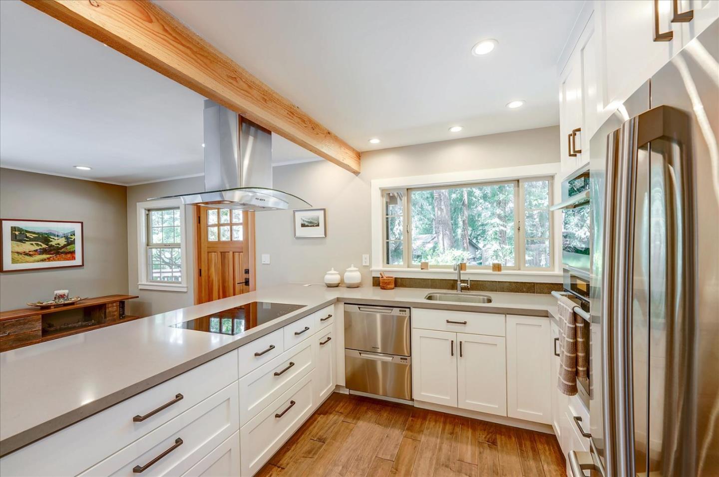 77 Forest Road Mount Hermon, CA 95041 - Photo 14 of 46 a kitchen with a sink stove and cabinets