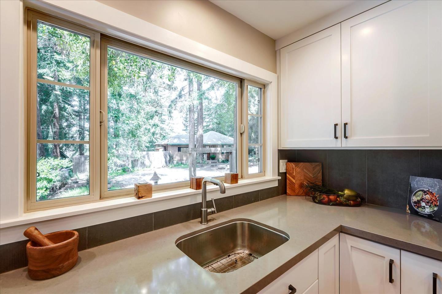 77 Forest Road Mount Hermon, CA 95041 - Photo 15 of 46 a kitchen with a sink and a large window