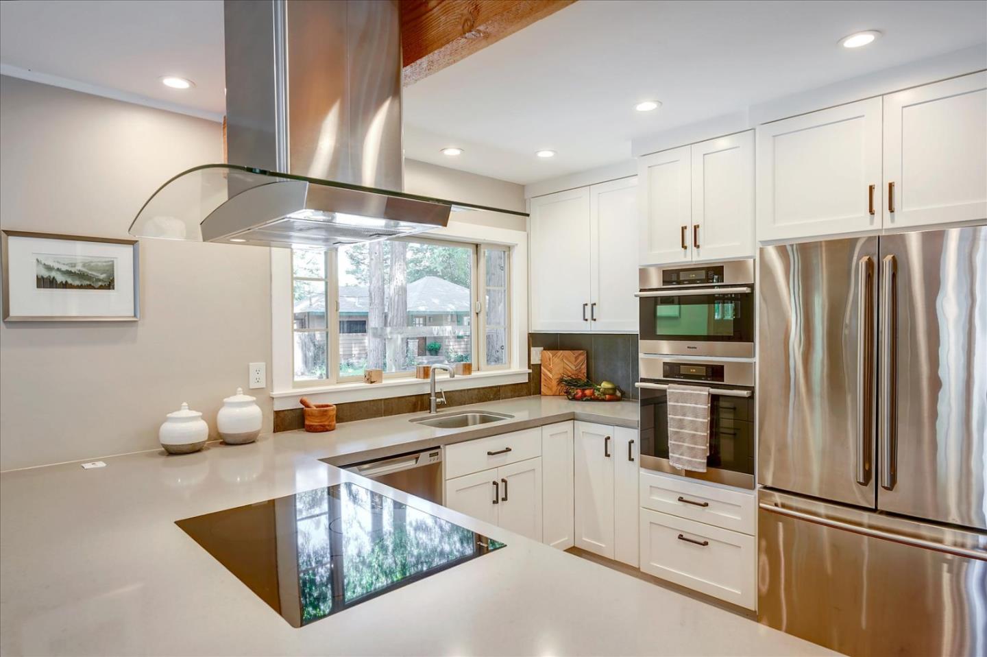 77 Forest Road Mount Hermon, CA 95041 - Photo 16 of 46 a kitchen with granite countertop a sink stainless steel appliances and cabinets