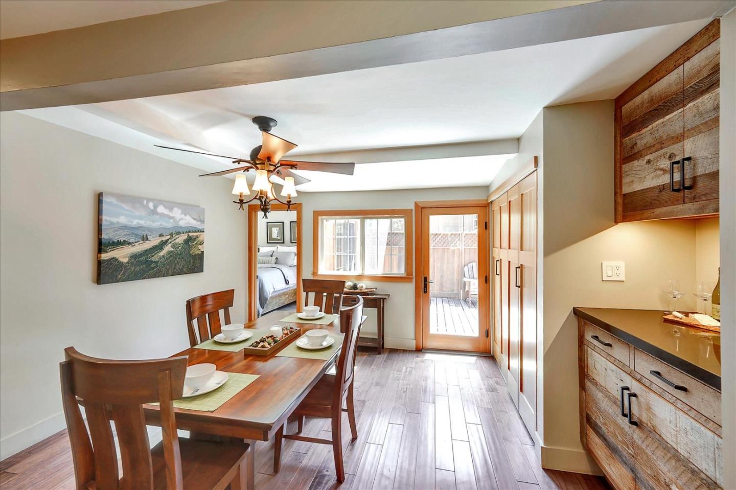 77 Forest Road Mount Hermon, CA 95041 - Photo 19 of 46 a view of a dining room with furniture a chandelier and wooden floor