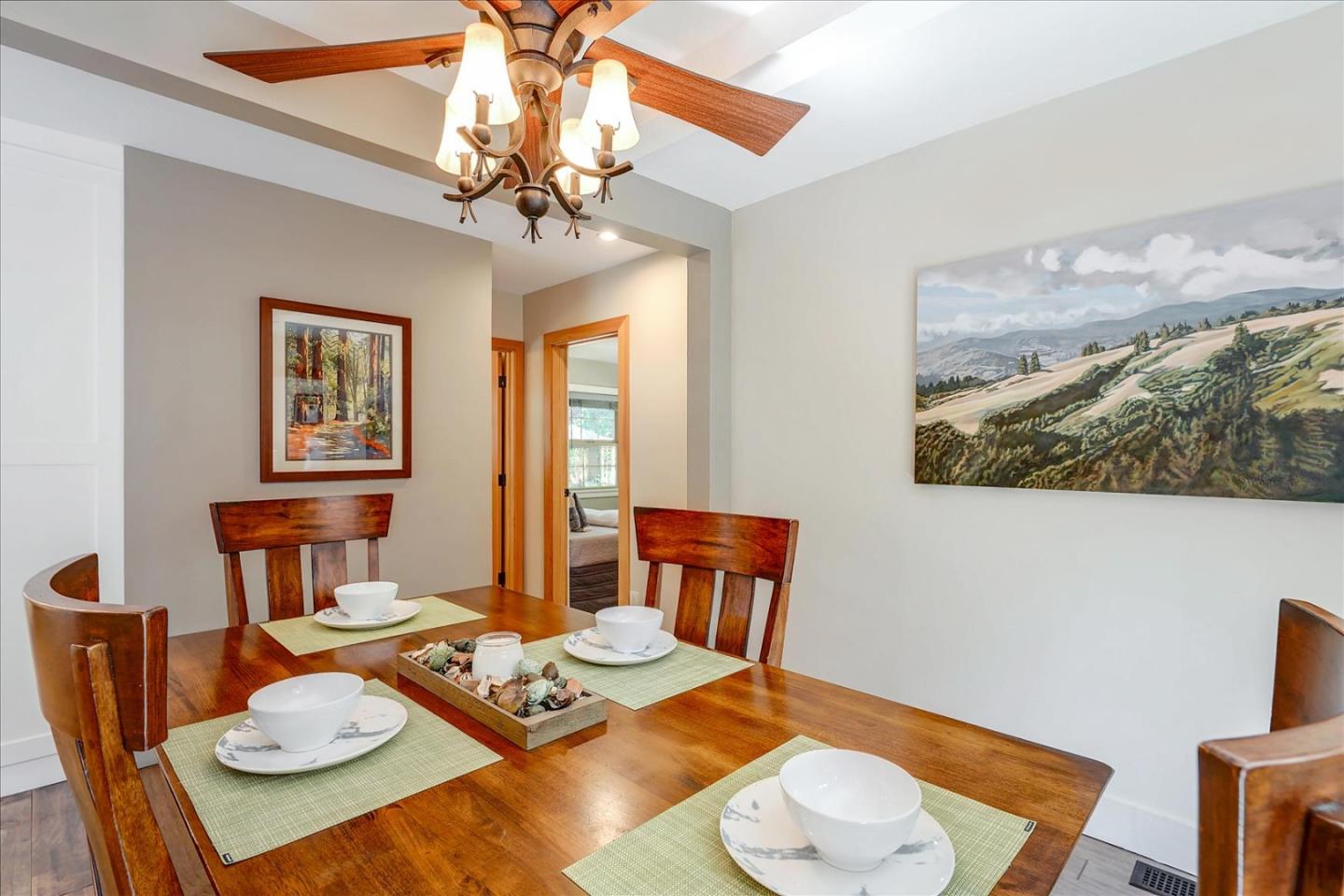 77 Forest Road Mount Hermon, CA 95041 - Photo 20 of 46 a view of a dining room with furniture a chandelier and wooden floor