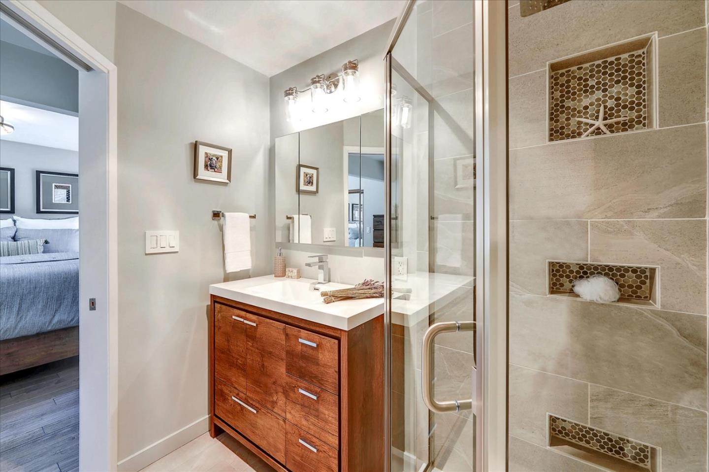 77 Forest Road Mount Hermon, CA 95041 - Photo 28 of 46 a bathroom with a sink a mirror and a shower