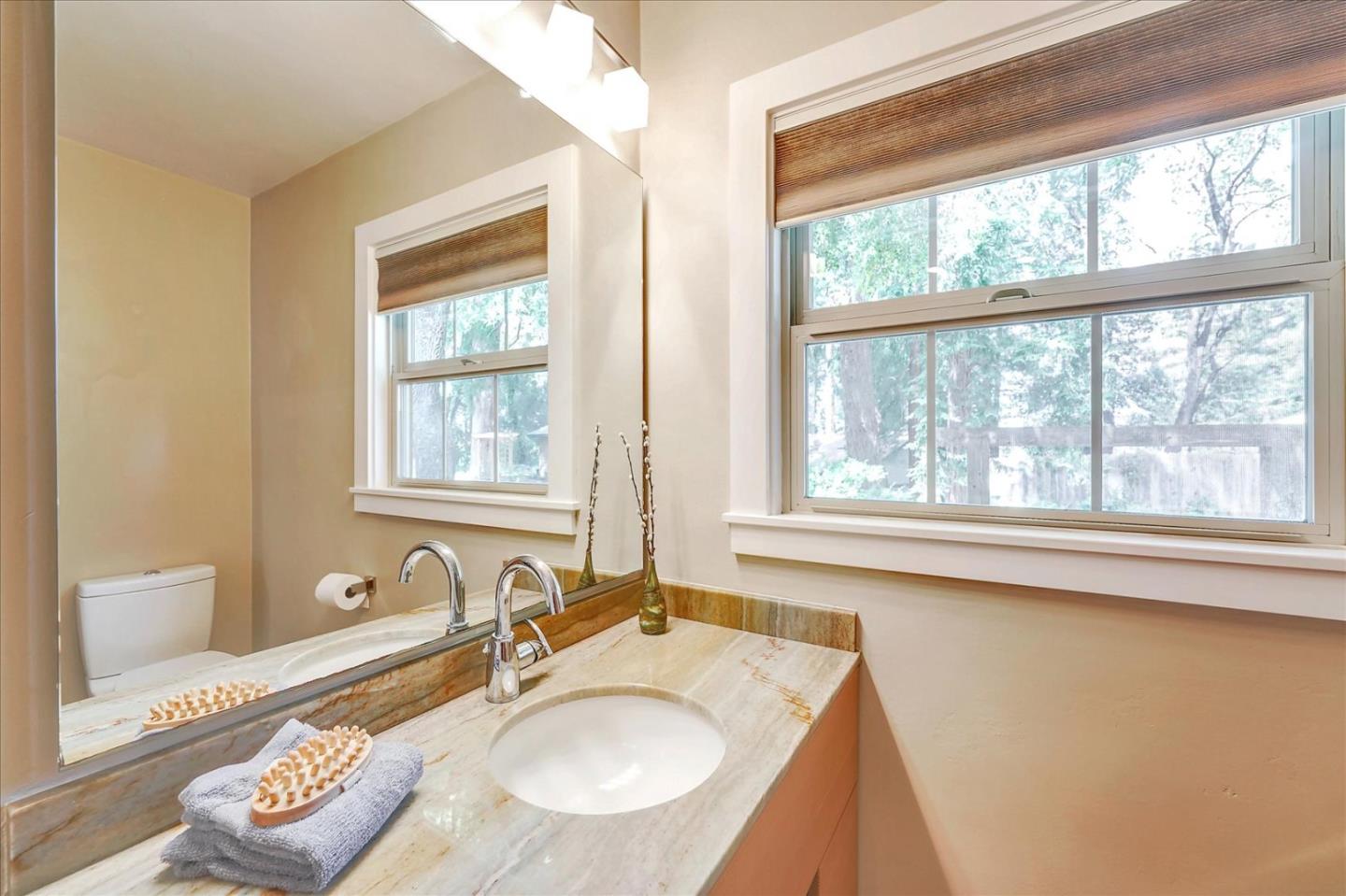 77 Forest Road Mount Hermon, CA 95041 - Photo 35 of 46 a bathroom with a granite countertop sink and a window