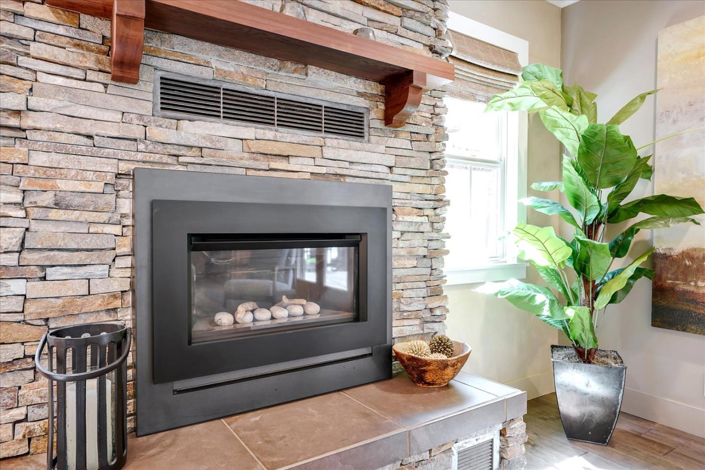 77 Forest Road Mount Hermon, CA 95041 - Photo 8 of 46 a living room with a potted plant on a fireplace