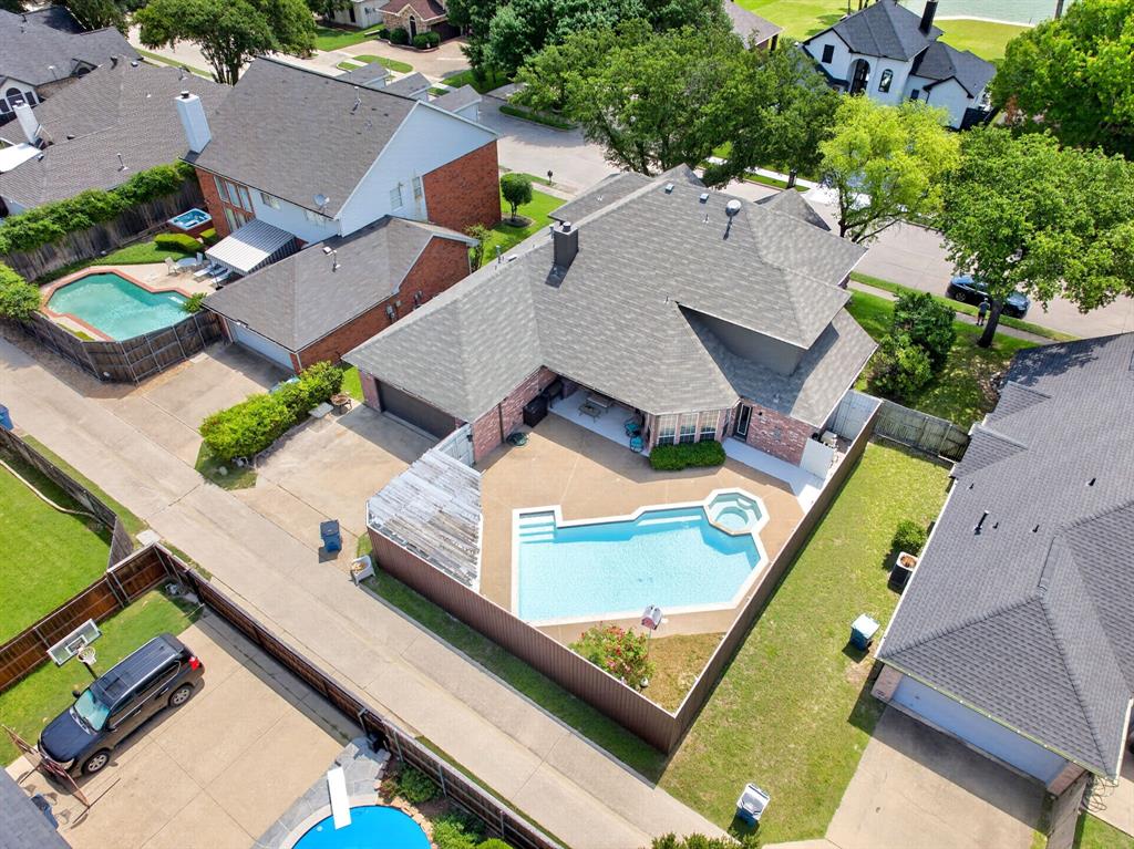 4509 Scenic Drive Rowlett, TX 75088 - Photo 35 of 40 Single-family residence featuring a private swimming pool with integrated spa and an expansive surrounding patio