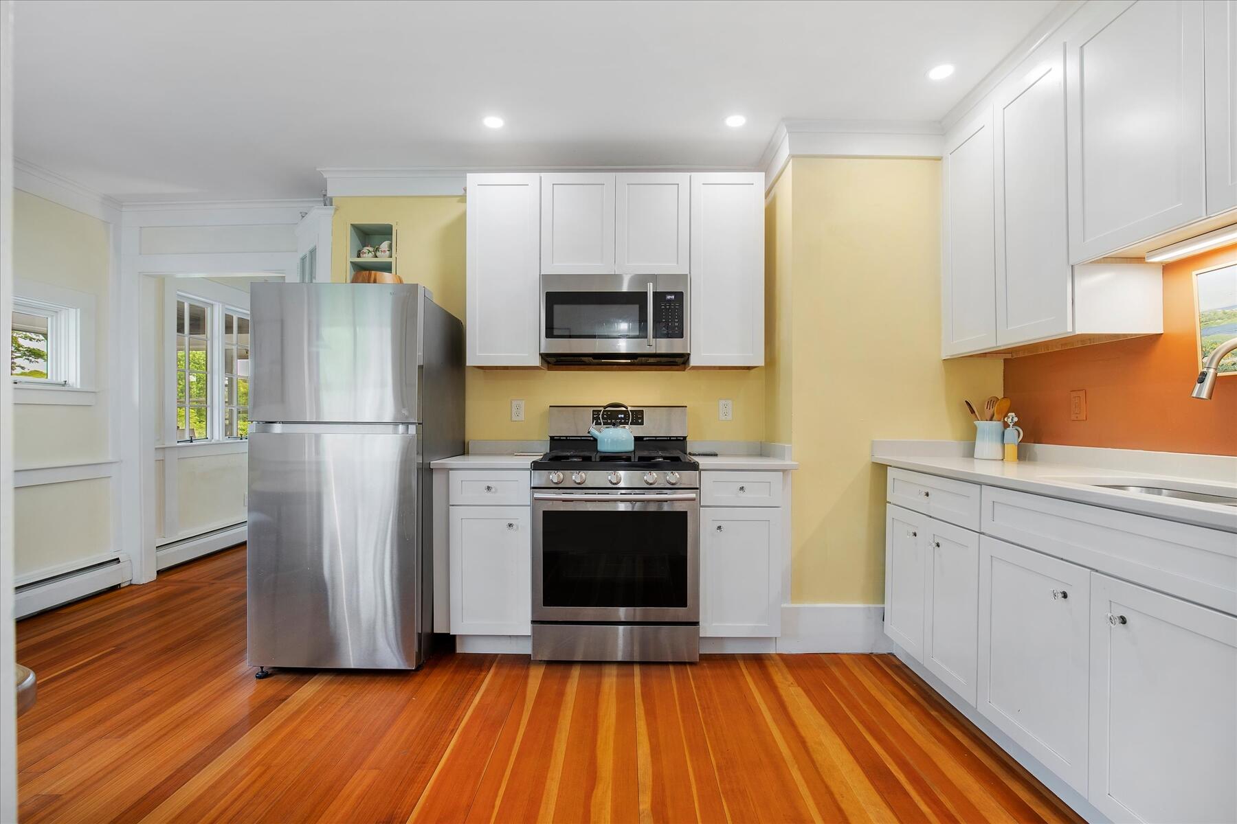 21 Quaker Road East Sandwich, MA 02537 - Photo 26 of 43 a kitchen with stainless steel appliances a refrigerator sink and microwave