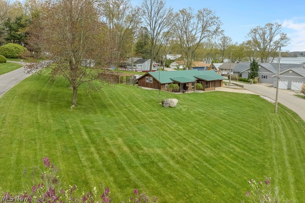6939 Lakeview Road Hanoverton, OH 44423 - Photo 42 of 42 View of yard featuring a garage