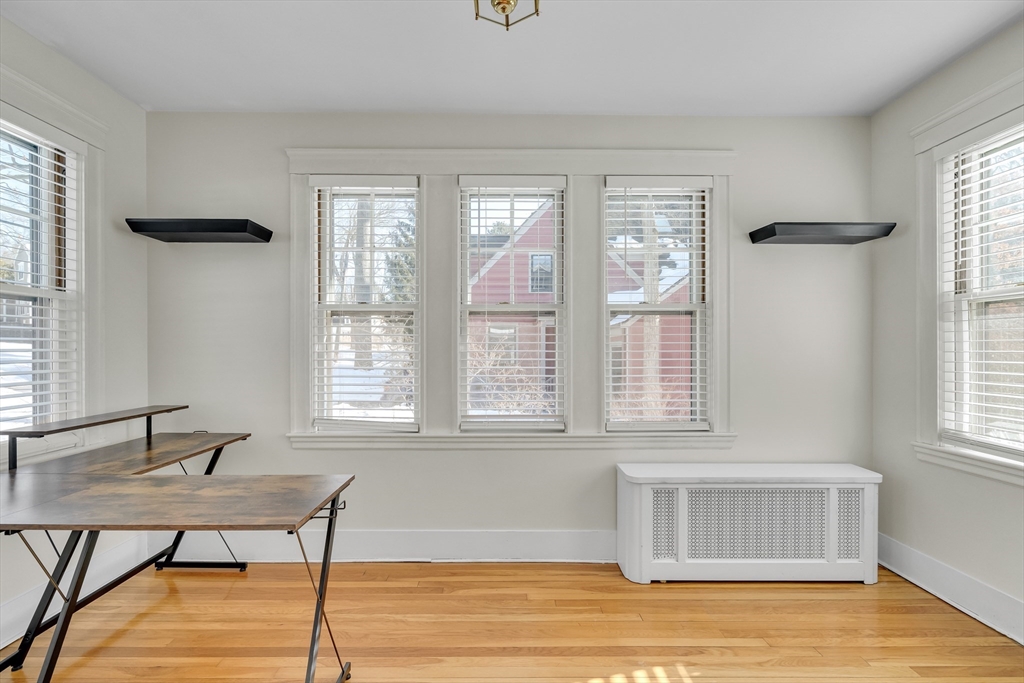 10 Dexter Road Lexington, MA 02420 - Photo 8 of 35 a living room with a table and a window