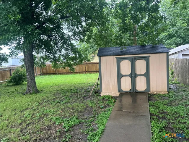 a sign that is sitting in the grass