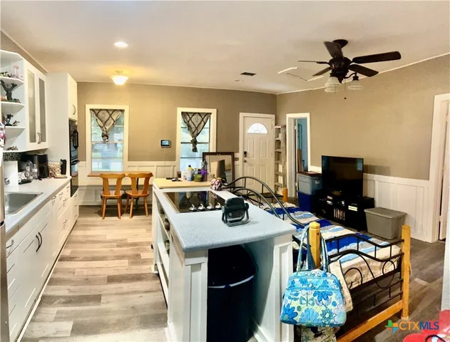 a very nice looking dining room with a large window and a fireplace