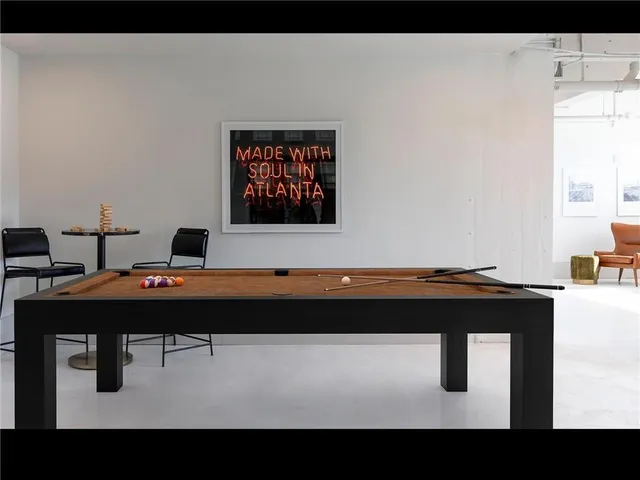 a room with a table and chairs