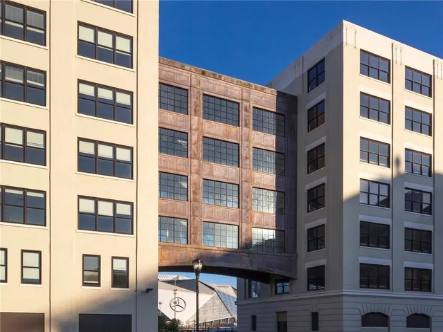 a front view of a building with a lot of windows