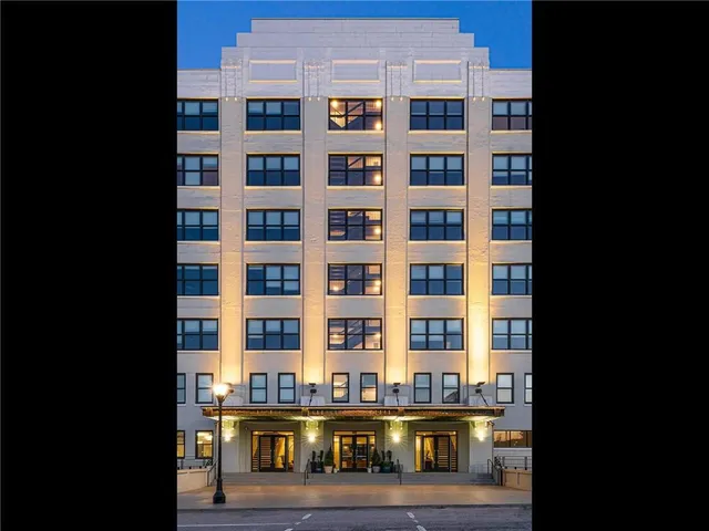 a front view of a building with glass windows