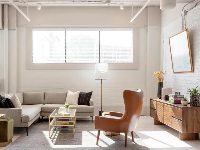a living room with furniture and a window