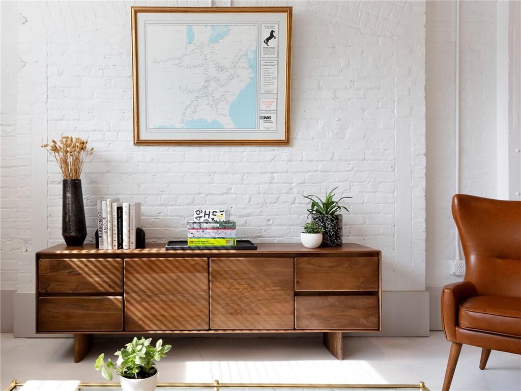125 Ted Turner Drive Southwest, Unit 802 Atlanta, GA 30303 - Photo 6 of 21 a dining room with furniture and wooden floor