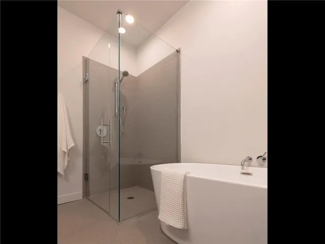 a bathroom with a shower and bathtub