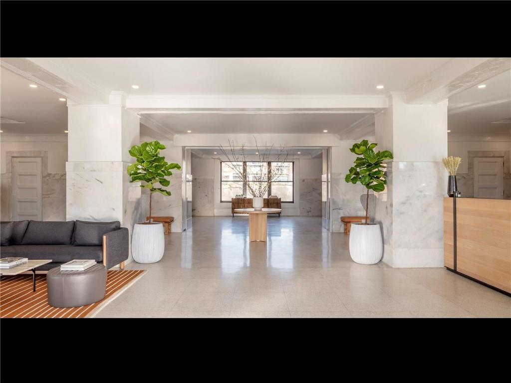 125 Ted Turner Drive Southwest, Unit 802 Atlanta, GA 30303 - Photo 10 of 21 a living room with furniture and wooden floor