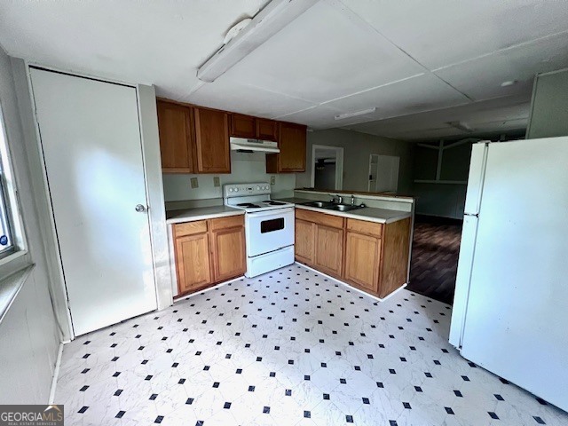 3195 Henderson Grove Road Sandersville, GA 31082 - Photo 26 of 50 a kitchen with granite countertop a sink a counter space cabinets and stainless steel appliances