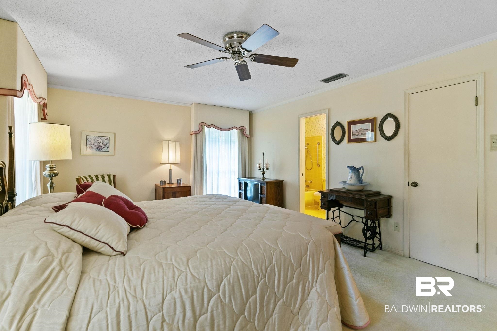 752 Evergreen Street Fairhope, AL 36532 - Photo 26 of 100 Bedroom with carpet flooring, a ceiling fan, a textured ceiling, crown molding, and ensuite bathroom