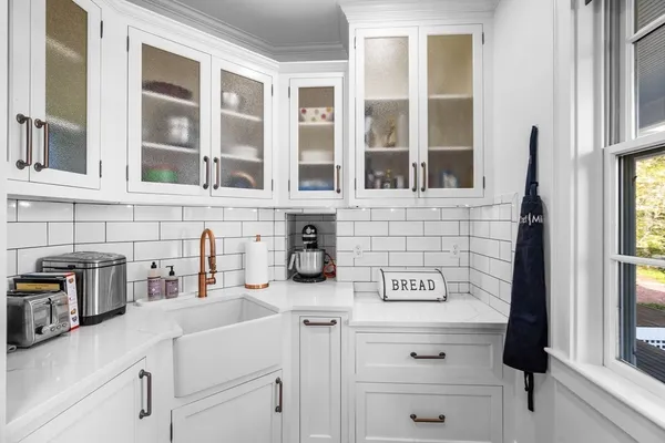 a kitchen with a sink and a window