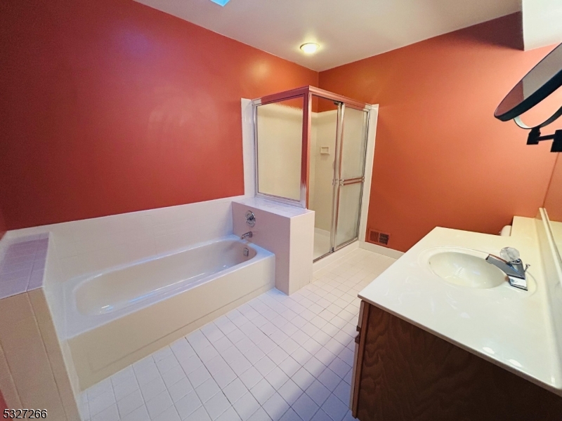 30 Willow Circle Hamburg, NJ 07419 - Photo 6 of 6 a bathroom with a bathtub and a sink