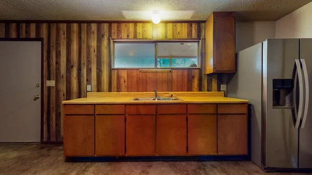 a bathroom with a sink a mirror and a window
