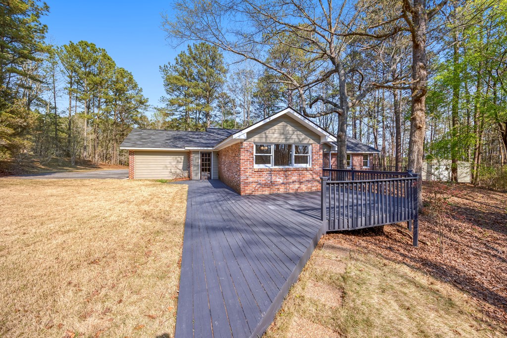 3330 Fortson Road Fortson, GA 31808 - Photo 14 of 46 a view of a house with wooden fence next to a yard