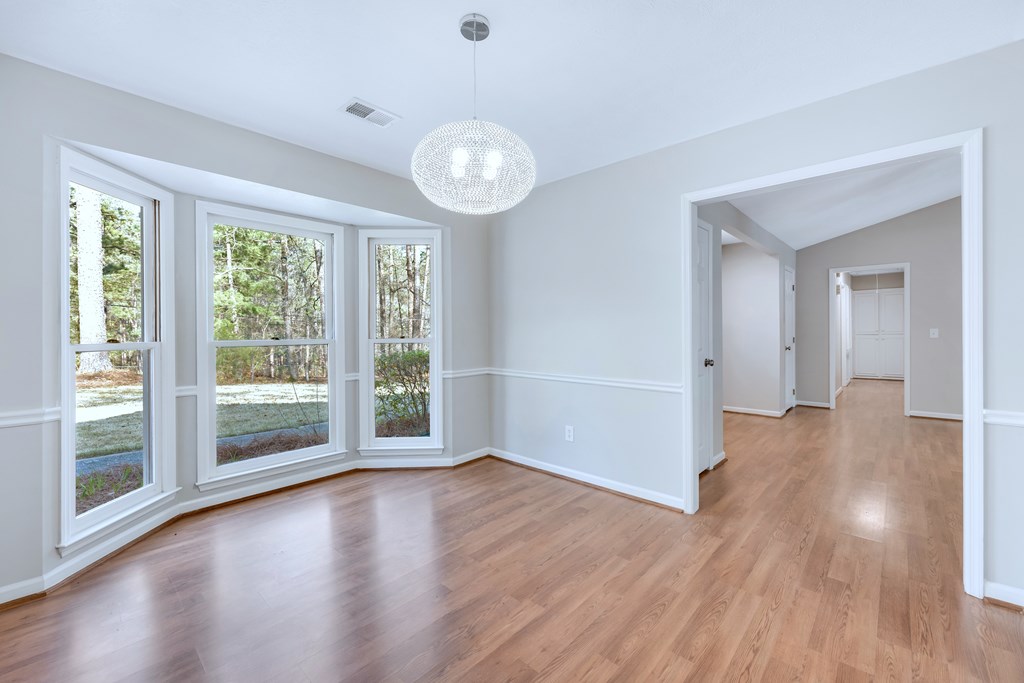 3330 Fortson Road Fortson, GA 31808 - Photo 23 of 46 a view of a big room with wooden floor and windows