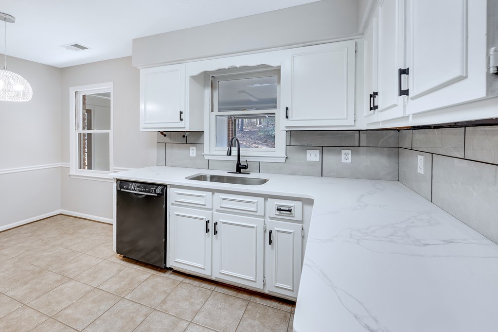 3330 Fortson Road Fortson, GA 31808 - Photo 26 of 46 a kitchen with white cabinets and sink