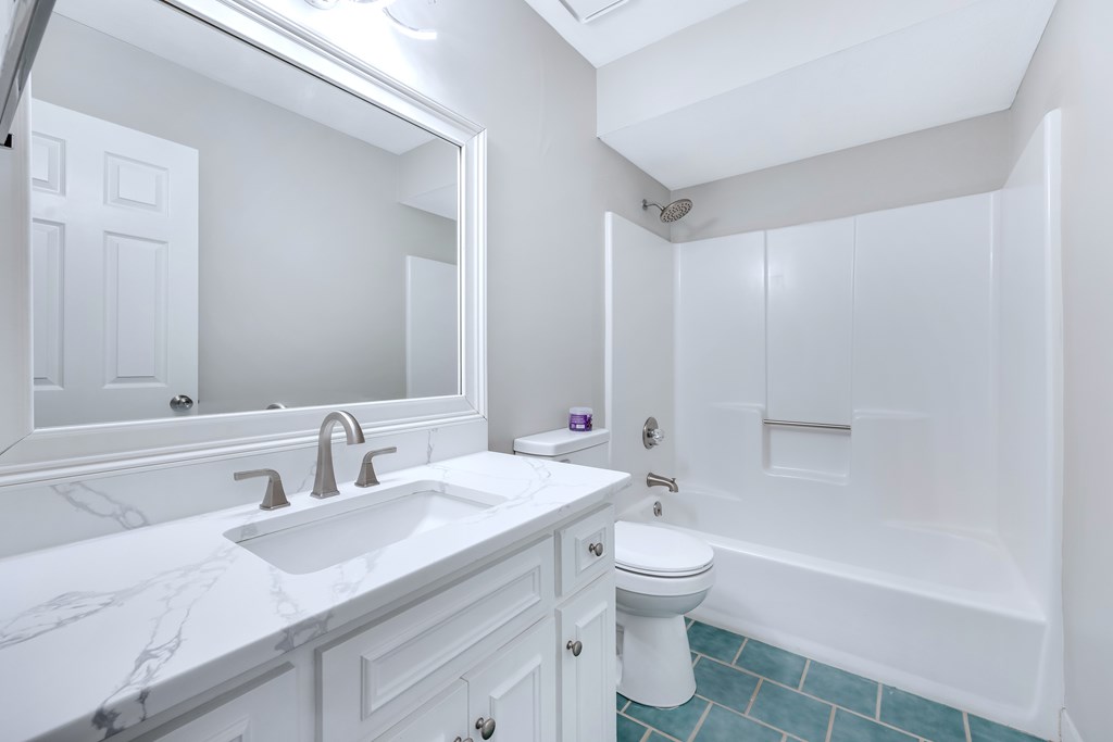 3330 Fortson Road Fortson, GA 31808 - Photo 31 of 46 a bathroom with a sink a toilet and shower