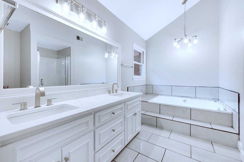 3330 Fortson Road Fortson, GA 31808 - Photo 39 of 46 a spacious bathroom with a double vanity sink a mirror and a bathtub