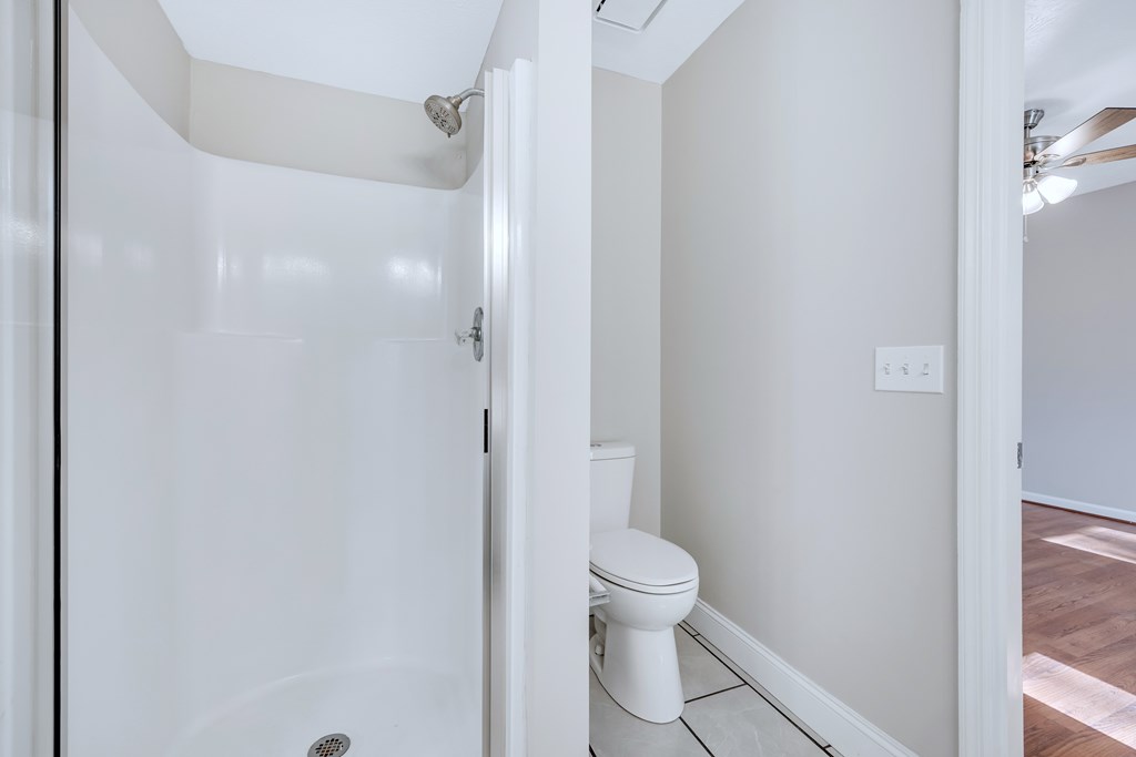 3330 Fortson Road Fortson, GA 31808 - Photo 40 of 46 a white toilet sitting next to a shower