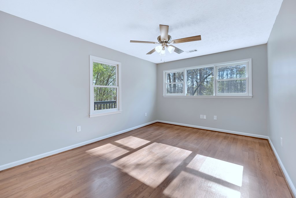 3330 Fortson Road Fortson, GA 31808 - Photo 43 of 46 a view of an empty room with wooden floor and a window
