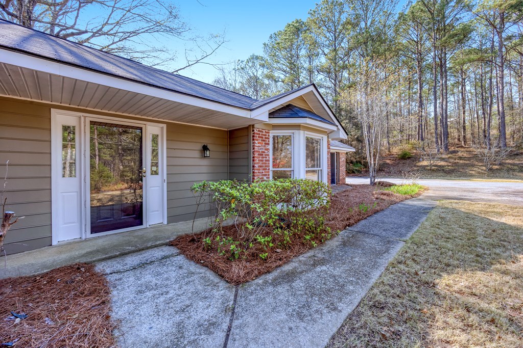 3330 Fortson Road Fortson, GA 31808 - Photo 10 of 46 a front view of a house with garden