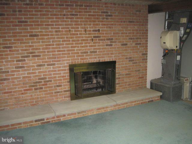 5108 Gunpowder Road Fairfax, VA 22030 - Photo 15 of 16 Unfinished basement with wood burning fireplace