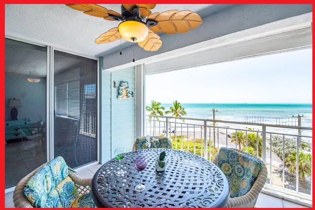 a view of a balcony with furniture