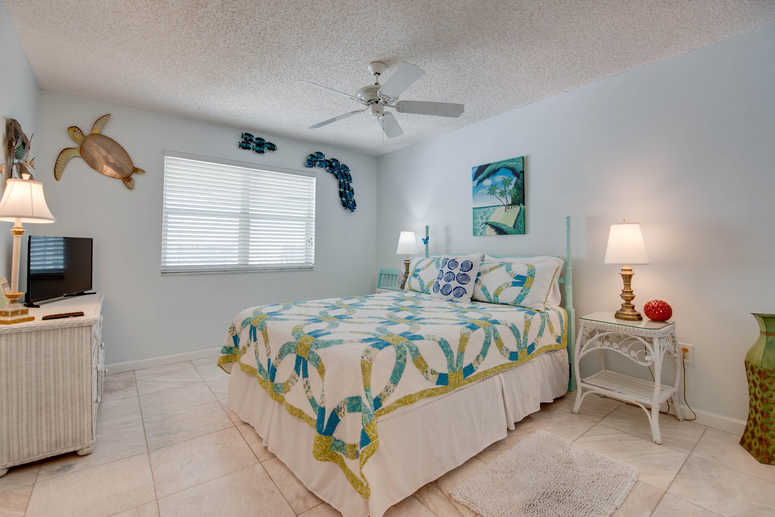 1901 South Roosevelt Boulevard, Unit 404S Key West, FL 33040 - Photo 15 of 39 a bedroom with a bed and a flat screen tv